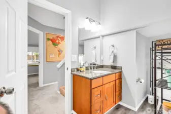 Across from the secondary bedroom is an updated full bathroom. Granite counters on the vanity with undermount sink, newer fixtures & light, lvp floors plus new tile surround in the shower