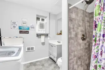 3/4 bath plus laundry room with newer vinyl floors, updated vanity & tile shower. Everything in this home has been done for you. Just move in!