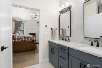 Dual vanities with quartz countertops and under mount sinks
