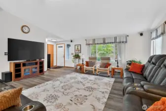 Living room looking out the front windows and front door