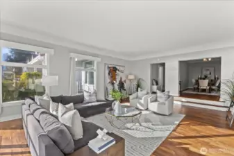 Living room and formal dining room connect and open up to the view everyone wants to see.