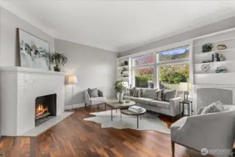 Front sitting room with fireplace welcomes you just inside the front door.
