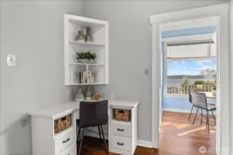 Kitchen is a blank canvas but currently offers small office or homework nook.