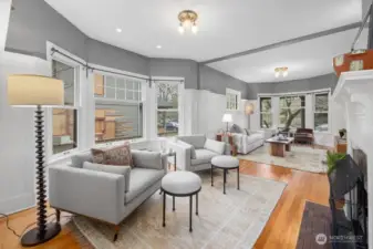 The bright and open living room is the perfect space to entertain or relax and unwind