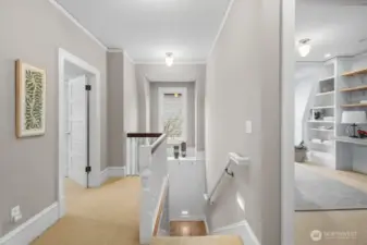 Upstairs hallway is open and bright