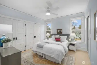 Primary bedroom with a wall of closets