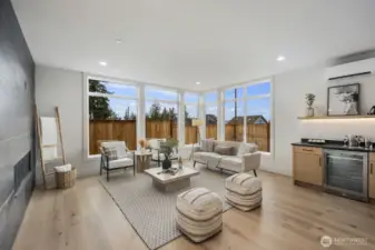 Beautiful engineered floors, fully tiled gas fireplace and tons of light