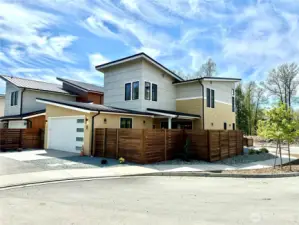 Corner lot with private fenced in and gated backyard.