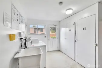 A view of the shared laundry room and storage. No 56 comes with the unit.