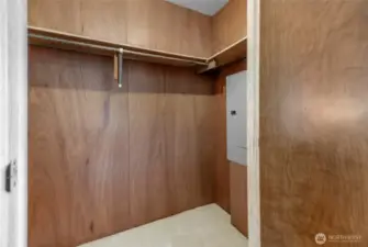 The primary suite walk-in closet.  The new electrical panel you see was installed in the last couple of years. The home also had a new furnace installed in the last two years.