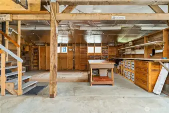 The current owners had a t.v. here in the barn, great place for a hobby room, or just a difference ambiance. The wood-burning stove is to the left behind the stairs to keep it cozy!