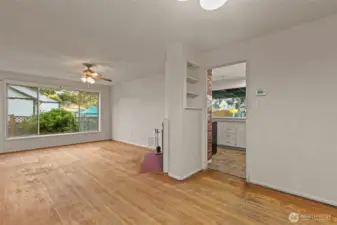 LIVING ROOM AND DINING AREA LEAD TO KITCHEN