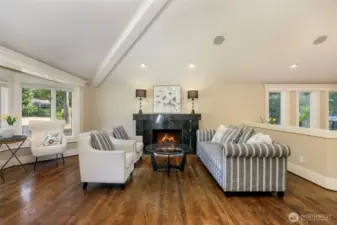 Living room with oversized granite wood fireplace