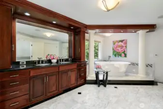 Primary bath suite with soaking tub, double sinks and granite counters