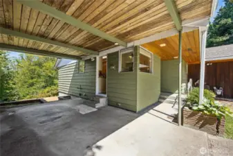 Carport. leads to the back yard and second enrty