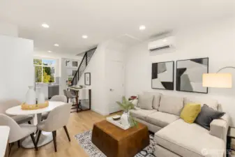 The open main level effortlessly flows between living, dining, and kitchen spaces for a natural sense of movement and ease.