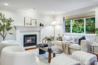 The heart of the home is the comfortable family room, which seamlessly adjoins the kitchen. Gather around the cozy gas fireplace, creating a warm and inviting atmosphere for everyday living and informal entertaining.