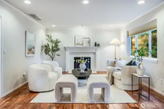 The heart of the home is the comfortable family room, which seamlessly adjoins the kitchen. Gather around the cozy gas fireplace, creating a warm and inviting atmosphere for everyday living and informal entertaining.