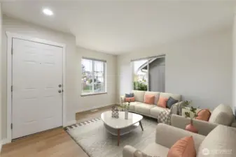 Virtually Staged. Sun-soaked living room highlighted by a large picture windows, crisp new interior paint, and stylish new flooring—creating an airy, welcoming first impression as you step inside.