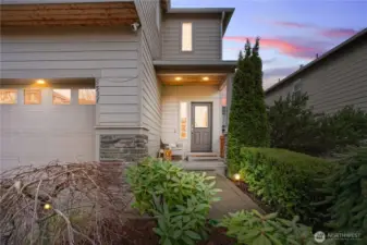 Mature landscaping leads to your front entry