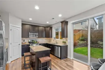 Slider off the kitchen leads to your perfectly landscaped and fully fenced back yard