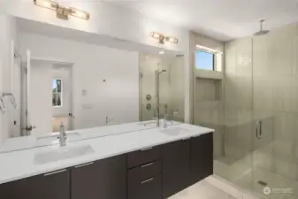 Relax in your spa-like bathroom equipped with dual-sinks, walk-in shower with hand-held and rain shower heads, & separate toilet room.  (Photos of similar home in Willow North)