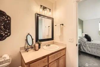 Convenient and private bathroom connects with primary bedroom.