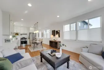 Living room looking towards kitchen and hall entry.