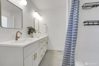Primary ensuite, double vanity, ceramic tile floors, quartz counter, gold fixtures