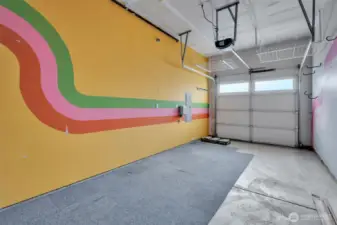 garage with ceiling racks and utility area (not visible)
