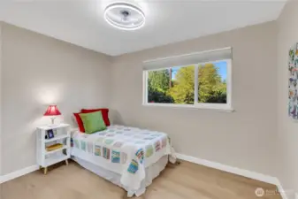 Bedroom #2 offers enough space for a queen bed, dresser, and nightstand.  New, light-blocking, light rise window treatment.