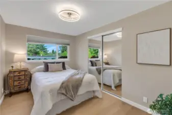 Bedroom #3 also has a ceiling fixture with a built-in fan.  The light has adjustable brightness settings from led light to a softer or incandescent level.  Shown here with a queen bed, nightstand.  All bedrooms have new, light blocking, light rise window coverings.