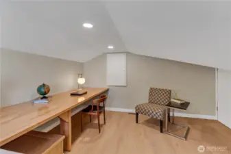 Bonus space!  Just a few steps up to this hide-away!  What will it be for you?  Home office? Craft space?  Project space?  Play space for children?  Study area?  Desk has fittings for computer and other cords.  Storage located to the right (door) and straight ahead as well.