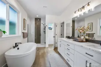 Oh my.. The tub after a long day the duel sinks, counter space for days and that shower!