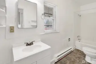 Full bath located off kitchen and outside 2nd bedroom.