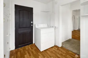 Laundry room and sunroom with the door to the back yard and patio.