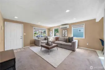 Open floor plan between living space and kitchen area