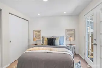 Bedroom #1 with French doors to the outdoor patio.