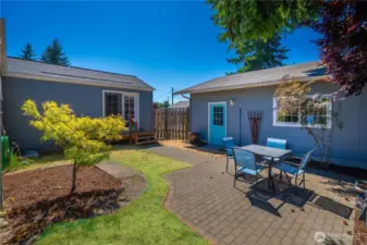 Relax in the backyard featuring a charming paver patio