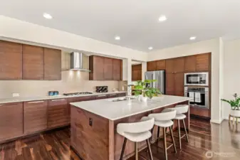 Open chef’s kitchen with stainless steel appliances