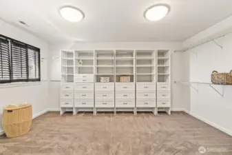 Inside the walk-in closet of the primary suite. Your inner Carrie Bradshaw will love it here!