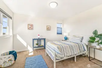 One of the four large and sunny upstairs bedrooms.