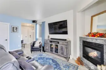 Views of entry frontdoor, garage and 1/2 bath on main