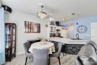 Dining area has updated lighting with hidden ceiling fan