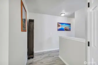 Spacious upstairs landing connects all bedrooms, laundry area, linen closet & full bath