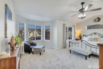 Primary bedroom features seating area, new carpet with upgraded pad.