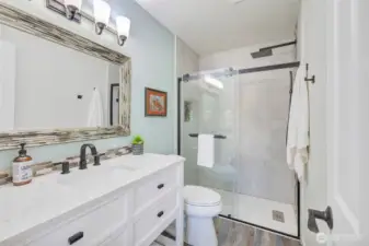 Primary bathroom has been completely remodeled. Beautiful floor to ceiling tiled walk in shower. New flooring, toilet, vanity and lighting