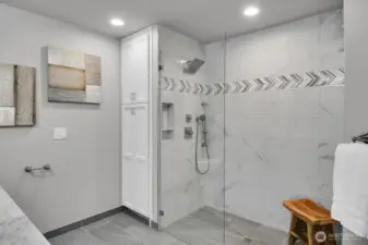 Totally remodeled Primary bath with addition of accessible double shower & linen closet.