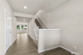 Spacious entryways with hard surface flooring grace the lower levels