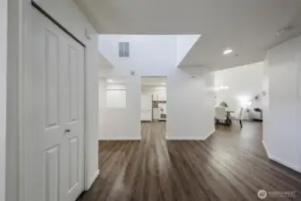 Big sitting room off the entry could also be an office space or wall it in & make it an enclosed den or bedroom. Loads of possibilities.